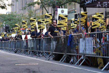 Photo for October 03, 2023 - New York , USA : A protest is currently underway at NBC Universal, 30 Rockefeller Center in New York, led by SAG-AFTRA and joined by the Transport Workers Union of America (TWU). - Royalty Free Image