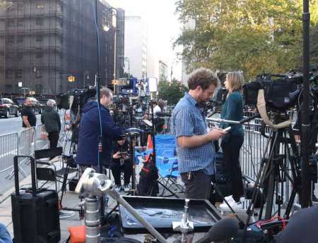 Photo for Press Corps At Donald Trump's 2nd Day Appearance for Court Fraud Trial in New York. October 3, 2023, New York, USA: Press corps waiting for the former US President, Donald Trump's arrival at the court on day two, for fraud trial in Manhattan. - Royalty Free Image