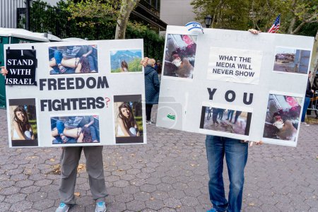 Photo for Pro-Israel Rally Held At New York City After Hamas Attack. October 8, 2023, New York, New York, USA: Participants hold placards describing the horrors inflicted by the Hamas militant at a pro-Israel rally - Royalty Free Image