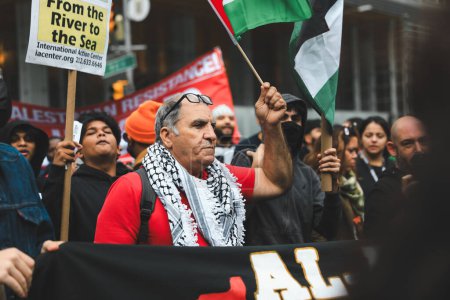 Photo for Palestinians Protest From Times Square to Israeli Consulate. October 08, 2023, New York, USA: Palestinian protestors march from Times Square to Israeli Consulate to protest against Israels declaration of war, Bidens support - Royalty Free Image