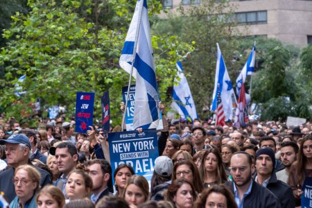 Photo for Rally And Vigil Held In New York City To Stand With Israel After Hamas Attack. October 10, 2023, New York, New York, USA: Thousands, many of them waving Israeli and American flags and carrying signs, attend a New York Stands With Israel - Royalty Free Image