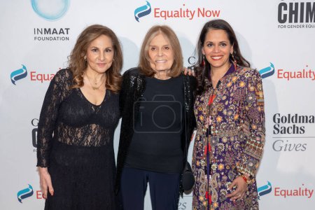 Photo for Equality Now Hosts Make Equality Reality Gala. October 11, 2023, New York, New York, USA: (L-R) Kathy Najimy, Gloria Steinem and Mona Sinha attend Equality Now Hosts Make Equality Reality Gala at Guastavino's - Royalty Free Image