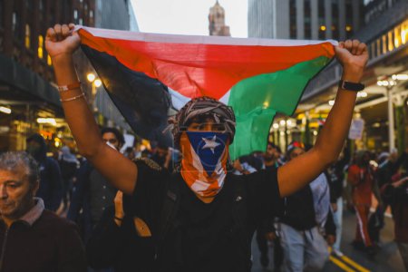 Photo for Palestinians Protest From Times Square to Israeli Consulate. October 13, 2023, New York, USA: Palestinian protestors march from Times Square to United Nations Headquarters to protest against Israels attacks on Palestinians - Royalty Free Image
