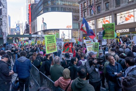 Photo for Pro-Palestinian Activists Gather For A Day Of Action. October 13, 2023, New York, New York, USA: Pro-Palestinian protestors, supported by the New York City chapter of the Democratic Socialists (DSA), hold signs and flags - Royalty Free Image
