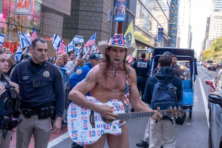 Photo for Pro-Palestinian Activists Gather For A Day Of Action. October 13, 2023, New York, New York, USA: Famed Times Square's street performer Robert John Burck, better known as the Naked Cowboy seen with Pro-Israel counterprotestors during a Pales - Royalty Free Image