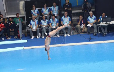 Photo for Trampolin 1m Masculine Preliminar Round 6. October 21, 2023, Santiago, Chile: The Trampolin 1m Masculine Preliminar, round 6 with only 12 athletes qualifying for the final at Aquatic Center in National Stadium, Santiago - Royalty Free Image