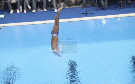 Photo for Trampolin 1m Masculine Preliminar Round 6. October 21, 2023, Santiago, Chile: The Trampolin 1m Masculine Preliminar, round 6 with only 12 athletes qualifying for the final at Aquatic Center in National Stadium, Santiago - Royalty Free Image