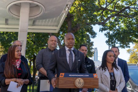 Photo for October 23, 2023 - New York, USA: Mayor Adams Signs Bill Paving Way For Electrification Of All City Government Vehicles. New York City Mayor Eric Adams speaks during Intro. 279-A bill signing ceremony at NYCHA&#39;s Ravenswood Houses - Royalty Free Image