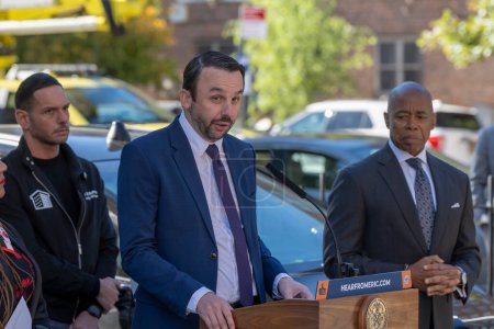 Photo for October 23, 2023 - New York, USA: Mayor Adams Signs Bill Paving Way For Electrification Of All City Government Vehicles.  City Councilmember Keith Powers speaks during Intro. 279-A bill signing ceremony at NYCHA&#39;s Ravenswood Houses - Royalty Free Image