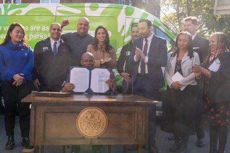 Photo for October 23, 2023 - New York, USA: Mayor Adams Signs Bill Paving Way For Electrification Of All City Government Vehicles. New York City Mayor Eric Adams signs Intro. 279-A at NYCHA&#39;s Ravenswood Houses on October 23, 2003 - Royalty Free Image