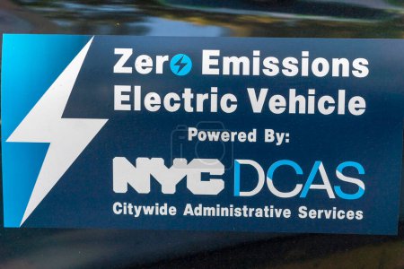 Photo for October 23, 2023 - New York, USA: Mayor Adams Signs Bill Paving Way For Electrification Of All City Government Vehicles. Zero Emission Electric Vehicle Sign seen on a city car during Intro. 279-A bill signing ceremony at NYCHA&#39;s - Royalty Free Image
