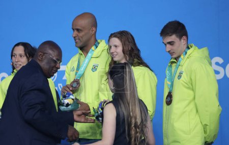 Photo for SANTIAGO, CHILE - 10/23/2023: Medal ceremony of the Mixed 4x100m Medley Relay won by the USA (Gold), Canada (Silver) and Brazil (Bronze) at the Aquatic Center of the National Stadium, Santiago, Chile. - Royalty Free Image