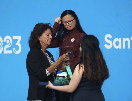 Photo for SANTIAGO, CHILE - 10/23/2023: - Medal ceremony in the women's 100m freestyle won by Canadian MACNEIL M (gold), Brazilian BALDUCCINI S (silver) and American DE LOOF C (bronze) at the Aquatics Center of the National Stadium, Santiago, Chile - Royalty Free Image