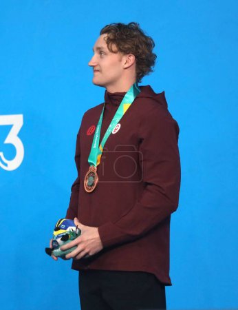 Photo for SANTIAGO (CHL), 10/23/2023: Medal ceremony in the men's 100 backstroke won by the American ADAM CHANEY (gold), the Argentinean SARAVIA U (silver) and the Canadian BLAKE TIERNEY (bronze) at the National Stadium. - Royalty Free Image