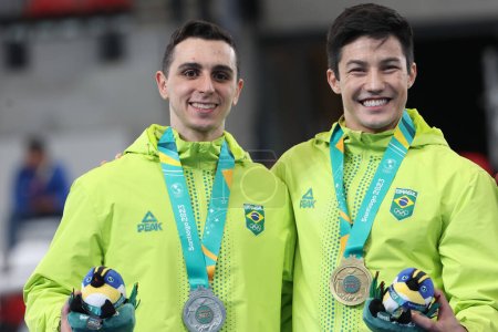 Photo for Santiago (Chile), 10/25/2023 -  Men's Artistic Gymnastics Final on Fixed Bar, with gold for Arthur Nory from Brazil, silver for Bernardo Miranda from Brazil and bronze for Rene Cournoyer from Canada - Royalty Free Image