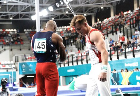 Photo for SANTIAGO, CHILE - 10/24/2023: Medal ceremony in the men's Anillos final with the American WHITTENBURG, D winning the gold, the Argentine VILLAFANE, D winning the silver and the Canadian Dolci Felix winning bronze at the Santiago National Stadium - Royalty Free Image