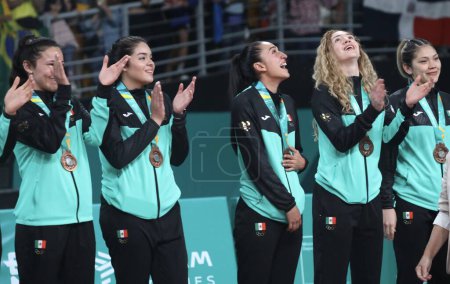 Photo for SANTIAGO, CHILE - 10/26/2023: Medal Ceremony of the Women's Team Volleyball Final with the Dominican Republic winning Gold, Brazil-Silver and Mexico-Bronze on the main court of Parque Arena O 'Higgins in Santiago - Royalty Free Image