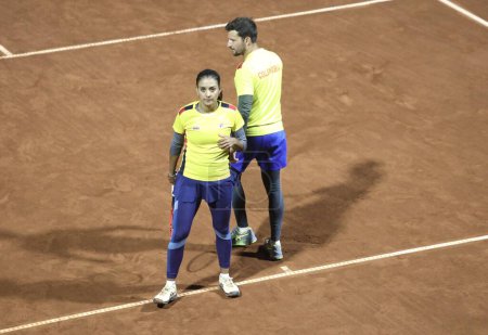 Photo for SANTIAGO (Chile), 10/28/2023 - Mixed doubles final for the gold medal between the Brazilian STEFANI Luisa, DEMOLINER Marcelo and the Colombian LIZARAZO Yuliana, BARRIENTOS Nicolas on the central sports court - Royalty Free Image
