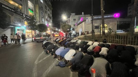 Photo for RAMALLAH (PALESTINE), 10/29/2023 - Some Palestinians pray to God in the streets to end the war, as many people are dying and being displaced from their homes. The Israel-Palestine conflicts began on October 7 - Royalty Free Image