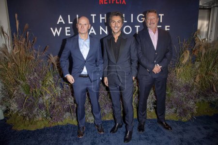 Photo for (NEW) Netflix&#39;s &quot;All The Light We Cannot See&quot; New York Screening. October 30, 2023, New York, New York, USA: Anthony Doerr, Shawn Levy and Steven Knight attend Netflix&#39;s &quot;All The Light We Cannot See&quot; New York Screening at - Royalty Free Image