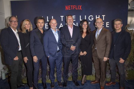 Photo for October 30, 2023 - New York, USA: (L-R) Josh McLaglen, Mary McLaglen, Shawn Levy, Anthony Doerr, Steven Knight, Carolina Garcia, Peter Friedlander, and Dan Levine attend Netflix's "All The Light We Cannot See" New York Screening at Paris Theater - Royalty Free Image