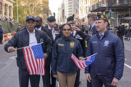 Photo for Veteran's Day Parade Held In New York City. November 11, 2023, New York, New York, USA: New York Mayor Eric Adams, First Deputy Commissioner Tania Kinsella and Emergency Management Commissioner Zachary Iscol - Royalty Free Image