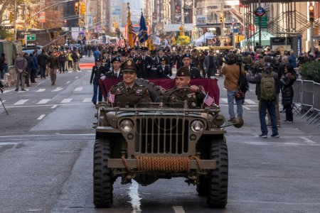 Photo for Veteran's Day Parade Held In New York City. November 11, 2023, New York, New York, USA: Army 1942 WWII MB2 Willys Jeep participates in the annual Veterans Day Parade on November 11, 2023 in New York City. Hundreds of people lined 5th Avenue - Royalty Free Image