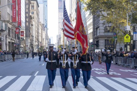 Photo for Veteran's Day Parade Held In New York City. November 11, 2023, New York, New York, USA: Members of the U.S. Marines participate in the annual Veterans Day Parade on November 11, 2023 in New York City. Hundreds of people lined 5th Avenue - Royalty Free Image