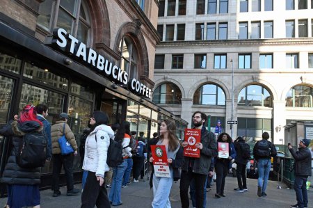 Photo for Starbucks workers have gone on strike due to the overwhelming demands and  understaffing of many of the stores. November 16, 2023, New York, U S A: Starbucks workers have been exerted to perform, especially during promotions like Red Cup Day. - Royalty Free Image