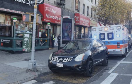 Photo for NEW YORK (USA), USA 11/24/2023 -  A male driver crashed a black Nissan Rogue AWD car into the entrance of the 157 Broadway subway station in Washington Heights, New York, on early this morning. Some police officers arrived prom - Royalty Free Image