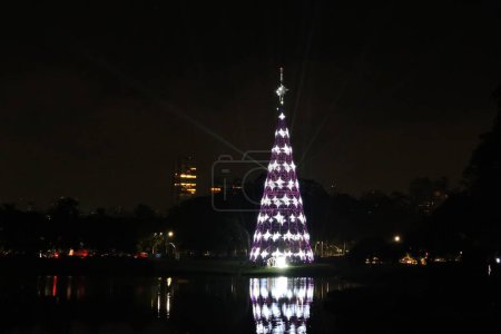 Photo for Sao Paulo Brazil (SP), 12/01/2023 -  Light and effects test of the Christmas tree in Ibirapuera Park that will be opened to the public this Saturday 12/02. - Royalty Free Image