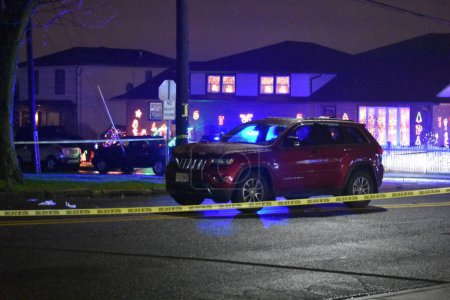 Photo for Officials investigate a pedestrian struck in Wallington, New Jersey. December 3, 2023, Wallington, New Jersey, USA: Officials from the Bergen County Sheriff's Office crime scene unit investigated a pedestrian struck by vehicle incident - Royalty Free Image
