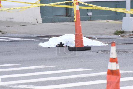 Photo for A moped driver was Killed in the Bronx, New York City. December 04, 2023, New York City, New York, USA: A moped driver was killed while riding in Webster Avenue in The Bronx by a hit and run driver. - Royalty Free Image