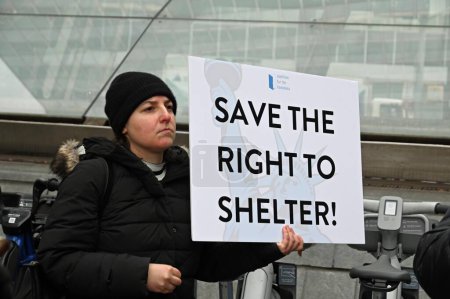 Photo for Various human rights organizations gather together in support of migrants rights and to add more homeless housing in New York. December 5, 2023, New York, U S A; At Bowling Green, in lower Manhattan, a coalition of advocate orgaizations - Royalty Free Image