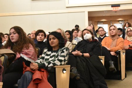 Photo for Audiences watches the speakers talk at the event. Noura Erakat, Marc Lamont Hill, and Nick Estes attend the Race, Liberation, and Palestine event at Rutgers University in New Brunswick, New Jersey. December 7, 2023, New Brunswick, New Jersey, USA - Royalty Free Image