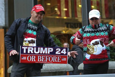 Photo for ( NEW) " Echoes of Loyalty" Trump Supporters in front of Trump Tower. December 17, 2023 , New York , USA :  Trump supporters gather in front of the renowned Trump Tower on 5th Ave, articulating their steadfast support for the former president. - Royalty Free Image