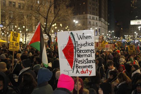 Photo for (NEW) Pro Palestine Protest during New Year's Eve in front of Macy's at Herald Square. December 31, 2023, New York, USA: Pro Palestine protesters gathered in front of Macy's Store at Herald Square during the New Year's Eve celebration - Royalty Free Image