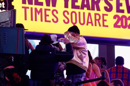 Photo for Flo Ri Da Performs at New Year's Eve at Times Square. December 31, 2023, New York, USA: Flo Ri Da, performs live at New Year's Eve at Times Square as fans scream and sing with the band - Royalty Free Image