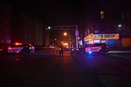 Foto de Shooting investigation in Newark, New Jersey. January 4, 2024, Newark, New Jersey, USA: Several people were reported suffering from gunshot wounds and fatalities were reported in a shooting near El Eden Grocery store - Imagen libre de derechos