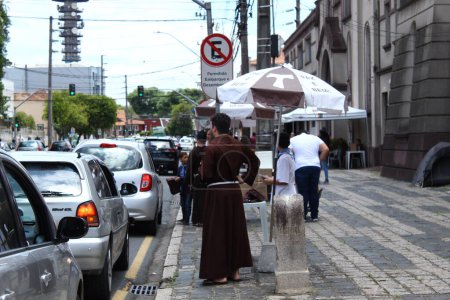 Photo for CURITIBA (PR), 01/05/2024 - RELIGION/FRIAR/CAPUCHINHOS/CAR BLESSING/PR - The traditional Blessing of Cars by the Capuchin Friars in the Nossa Senhora da Merces Parish takes place in Curitiba (PR) - Royalty Free Image