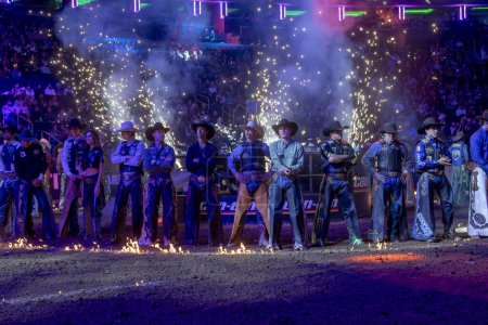 Photo for 2024 Professional Bull Riders At The Garden. January 6, 2024, New York, New York, USA: Bull riders stand on the field during the opening ceremony for the second round of the Professional Bull Riders 2024 Unleash The Beast event at Madison Square - Royalty Free Image