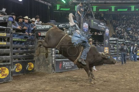 Photo for 2024 Professional Bull Riders At The Garden. January 6, 2024, New York, New York, USA: Mauricio Gulla Moreira rides Outlaw during second round of the Professional Bull Riders 2024 Unleash The Beast event at Madison Square Garden - Royalty Free Image