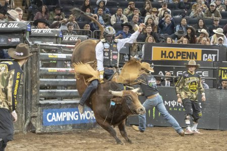 Photo for 2024 Professional Bull Riders At The Garden. January 6, 2024, New York, New York, USA: Brady Fielder rides Coco during second round of the Professional Bull Riders 2024 Unleash The Beast event at Madison Square Garden on January 6, 2024 - Royalty Free Image