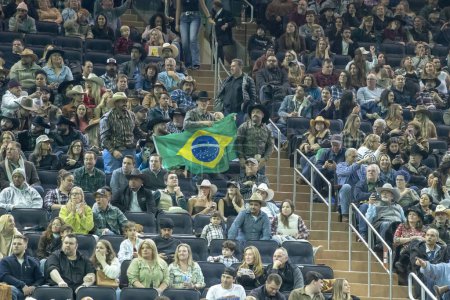 Photo for 2024 Professional Bull Riders At The Garden. January 6, 2024, New York, New York, USA: Spectators display a Brazilian banner during second round of the Professional Bull Riders 2024 Unleash The Beast event at Madison Square Garden - Royalty Free Image