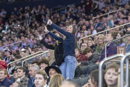 Photo for 2024 Professional Bull Riders At The Garden. January 6, 2024, New York, New York, USA: Spectators sing along during second round of the Professional Bull Riders 2024 Unleash The Beast event at Madison Square Garden on January 6, 2024 in New York - Royalty Free Image