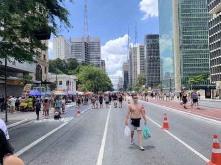 Photo for Paulistanos Having Fun on Avenida Paulista on Sunday. January 7, 2023, Sao Paulo, Brazil: Paulistanos and tourists are seen enjoying themselves on Avenida Paulista on Sunday as the avenue is for no car usage for this day. - Royalty Free Image