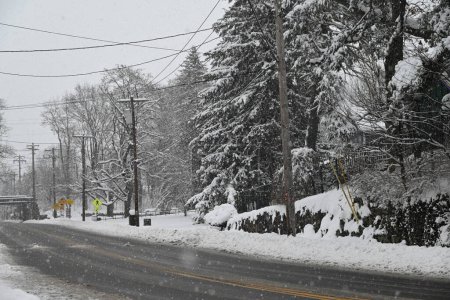 Photo for High snowfall rates in Port Jervis, New York. January 7, 2024, Port Jervis, New York, USA: Over 13 inches fell in Port Jervis, New York during the first snowstorm of 2024. Cars were stuck and residents were stranded on the highways and driveways - Royalty Free Image