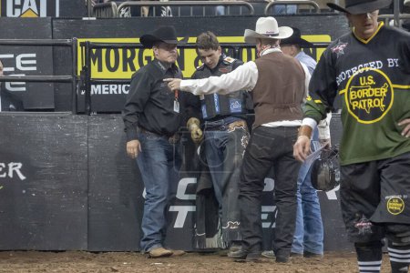 Photo for 2024 Professional Bull Riders Unleash The Beast At The Garden. January 7, 2024, New York, New York, USA: PBR medical crew rush to aid Joao Lucas Campos after being trampled by Fierce's Dirt Nap during third round of the Professional Bull Riders - Royalty Free Image