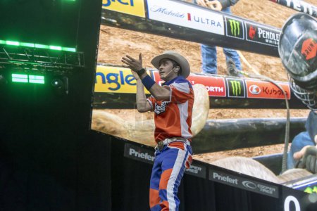 Photo for 2024 Professional Bull Riders Unleash The Beast At The Garden. January 7, 2024, New York, New York, USA: PBR Entertainer Brinson James interacts with spectators during third round of the Professional Bull Riders 2024 Unleash The Beast event - Royalty Free Image