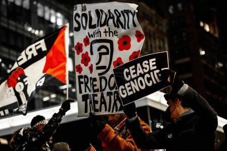 Photo for Solidarty With The Freedom Theatre: January 13, 2024, Manhattan, New York, USA: Protesters gathered today at 42nd St. and 6th Ave. in Manhattan, expressing solidarity with The Freedom Theatre and demanding the immediate release of Mustafa Sheta - Royalty Free Image
